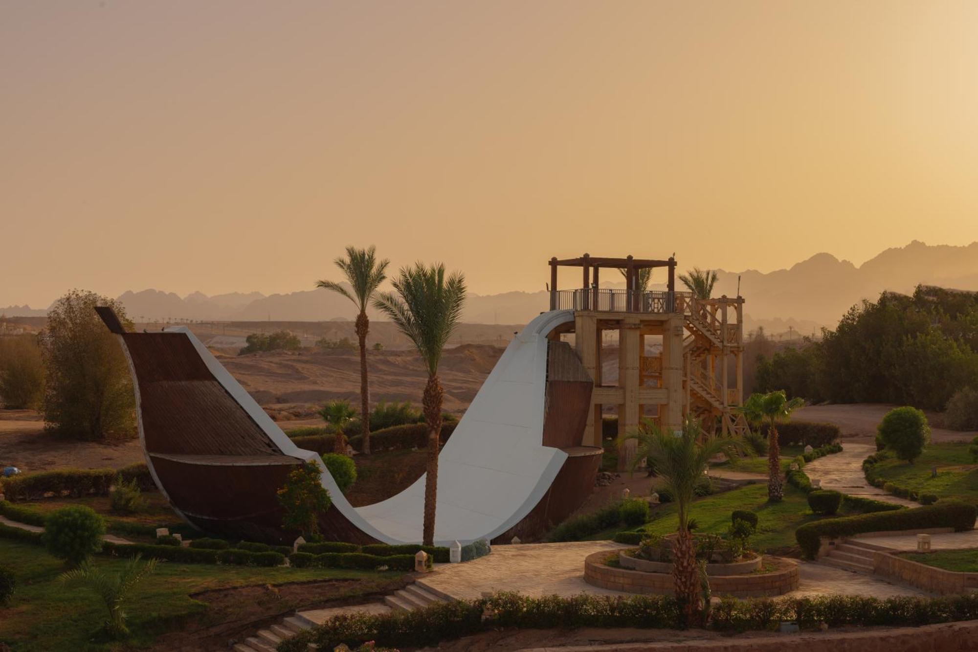 Jaz Sharm Dreams Hotel Exterior photo Sunset at the water park